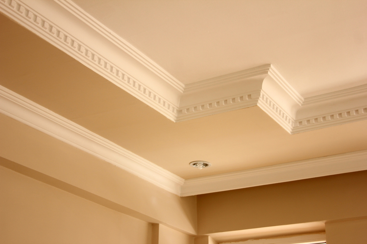 Elegant ceiling with tan and cream paint colors- types of crown molding